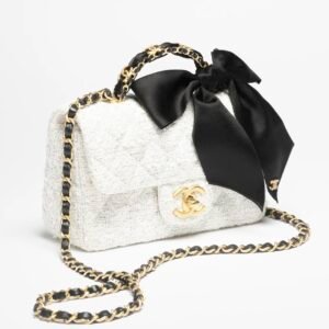 MINI FLAP BAG WITH TOP HANDLE
 
Tweed, Silk & Gold-Tone Metal 
White & Black