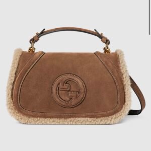 Gucci Blondie medium top handle bag
Variation
brown suede
