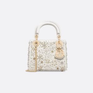 Dior Lady Dior Mini Bag in latte-colored satin embroidered with tone-on-tone pearls.