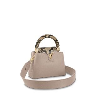 Louis Vuitton Capucines bag, crafted from Taurillon leather in a beige or light taupe color with a python skin top handle and strap